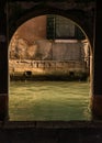 Arch passageway leading to a canal in Venice, Italy. Royalty Free Stock Photo