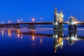 The arch of the Queen Louise Bridge is reflected in the night Neman. Ice drift along the Neman rive
