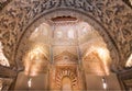 Arch with relief in historical style, ceiling of 14th century Madraza de Granada, Spain Royalty Free Stock Photo