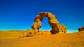 Arch Rock formation aka Arch of Africa or Arch of Algeria with moon at Tamezguida in Tassili nAjjer national park in Algeria Royalty Free Stock Photo