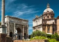 Arch of Septimius Severus and medieval church in Roman Forum, Rome Royalty Free Stock Photo