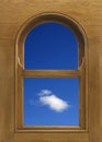 Arch shaped wood window frame with white cloud in blue sky Royalty Free Stock Photo