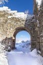 Arch of snow citadel of he ancient cave city of Mangup-Kale in the snow Royalty Free Stock Photo