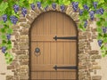 Arch of stone grapes and wooden door