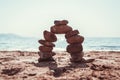 Arch of stones on the sea summer beach Royalty Free Stock Photo
