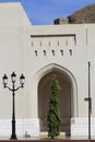 Arch, tree, lamp and watchtower at the Colonnade in Old Muscat Royalty Free Stock Photo