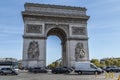 The Arch of Triomphe in Paris agains a blue sky