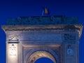 Arch of Triumph Arcul de Triumf building in Bucharest Romania during the evening with traffic lights at bottom of it