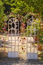 Arch for a wedding ceremony on the street .The decor is decorated with arches in the form of doors with fresh flowers Royalty Free Stock Photo