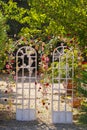 Arch for a wedding ceremony on the street .The decor is decorated with arches in the form of doors with fresh flowers Royalty Free Stock Photo