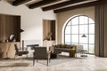 Arch window in modern beige living room. Corner view