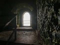 Arch window in old fortified Hell Fire club hunting logs