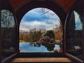 Arch window overlooking the outside of the park and nature.