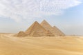 Archaeological complex of Great Egyptian Pyramids is located on the Giza plateau. Pyramids of Chephren Khafra and Cheops Khufu and Royalty Free Stock Photo