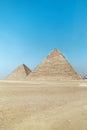 archaeological complex of Great Egyptian Pyramids is located on the Giza plateau, in the Libyan desert, on the left bank of the Royalty Free Stock Photo