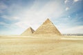 archaeological complex of Great Egyptian Pyramids is located on the Giza plateau, in the Libyan desert, on the left bank of the Royalty Free Stock Photo