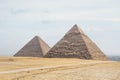 archaeological complex of Great Egyptian Pyramids is located on the Giza plateau, in the Libyan desert, on the left bank of the Royalty Free Stock Photo
