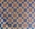 Archaeological remains of Roman mosaic with geometric figures, red and blue squares forming a checkerboard pattern on the floor of Royalty Free Stock Photo