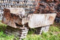 Archaeological site of Ostia Antica: Wall with chromatic decoration and sarcophagus Royalty Free Stock Photo