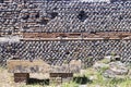 Archaeological site of Ostia Antica: Wall with chromatic decorations and sarcophagust Royalty Free Stock Photo