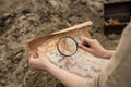 Archaeologist excavates and searches for treasure