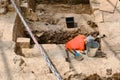 An archaeologist is excavating an ancient building. Archaeological work on the excavation of monuments of past centuries