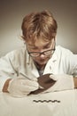 Archaeologist researcher taking samples of cuneiform material Royalty Free Stock Photo