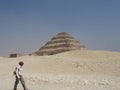 Archaeologist walks past the Step pyramid in Egypt