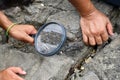 Archaeologists are using tools and equipment to explore fossils found in sedimentary rocks