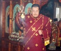 Archdeacon with a censer censes the Holy Liturgy in the Orthodox Church Royalty Free Stock Photo