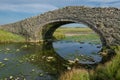 The arched Aberffraw Bridge in Anglesey Royalty Free Stock Photo