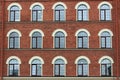 Arched brick house windows Royalty Free Stock Photo