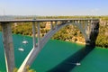 Arched bridge across Krka river in Croatia. Croatian river landscape in spring and summer, Europe. Automobile bridge Royalty Free Stock Photo