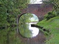 An arched bridge on the Grand Union Canal at Lapworth in Warwickshire, England Royalty Free Stock Photo