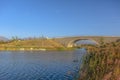 Arched bridge and Oquirrh Lake against blue sky Royalty Free Stock Photo
