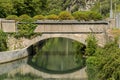 Arched bridge over the river Royalty Free Stock Photo