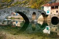 Arched bridge reflected in Crnojevica river, Montenegro Royalty Free Stock Photo