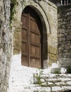 Arched brown wooden door of a traditional ottoman house in the old town of Berat, Albania Royalty Free Stock Photo