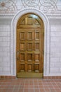 Arched door with decorative doorframe and block walls in a church at downtown Tucson, Arizona Royalty Free Stock Photo