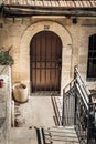 The arched door with metal lattice in Jerusalem, Israel