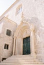 Arched door with stucco in a medieval Dominican monastery. Dubrovnik, Croatia