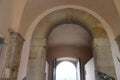 an arched doorway made ofblack stone in the past