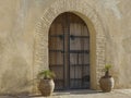 Arched doorway with an old wooden door Royalty Free Stock Photo