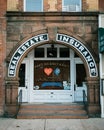 Arched doorway with Real Estate & Insurance sign, Northport, New York