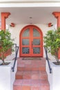Arched double door with ornate glass panel at San Clemente, California