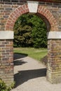 Arched entrance in brick wall Royalty Free Stock Photo