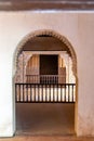 Arched entrance revealing detailed lattice screens within Alhambra historical Nasrid Palaces Royalty Free Stock Photo