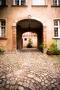 Arched entrance to courtyard on old European building Royalty Free Stock Photo