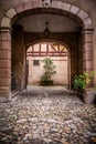 Arched entrance to courtyard on old European building Royalty Free Stock Photo