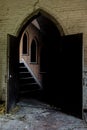 Arched Entry to Wood Paneled Hallway - Collapsing, Abandoned Church